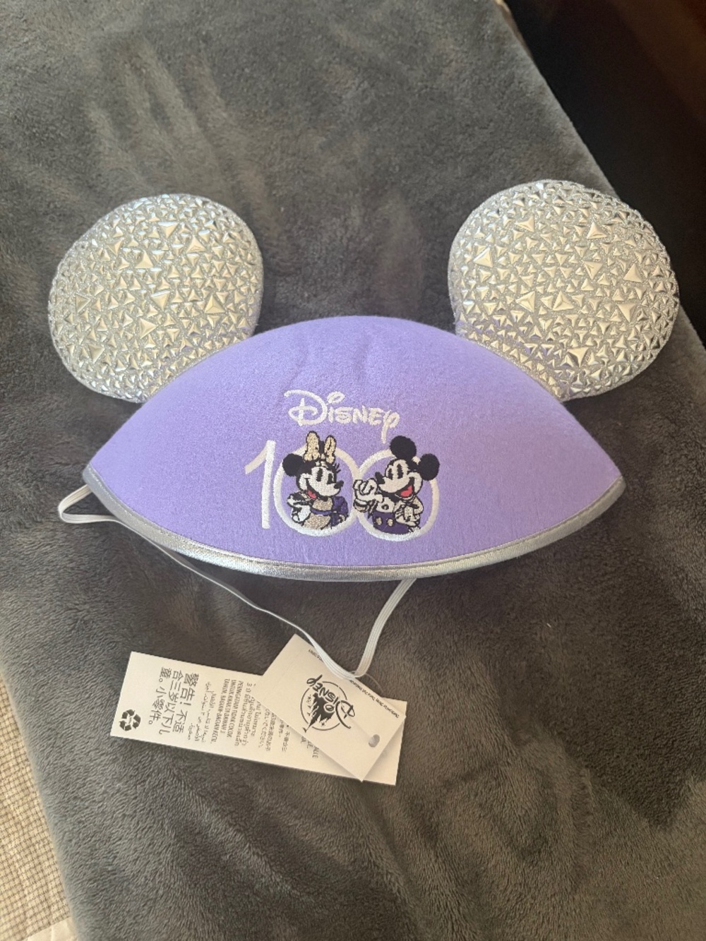 Disney light purple 100years hat with silver padded ears. Adult sized.